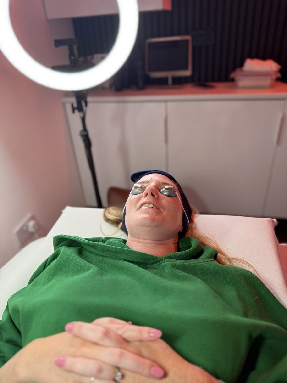 A client resting on the treatment couch during a session