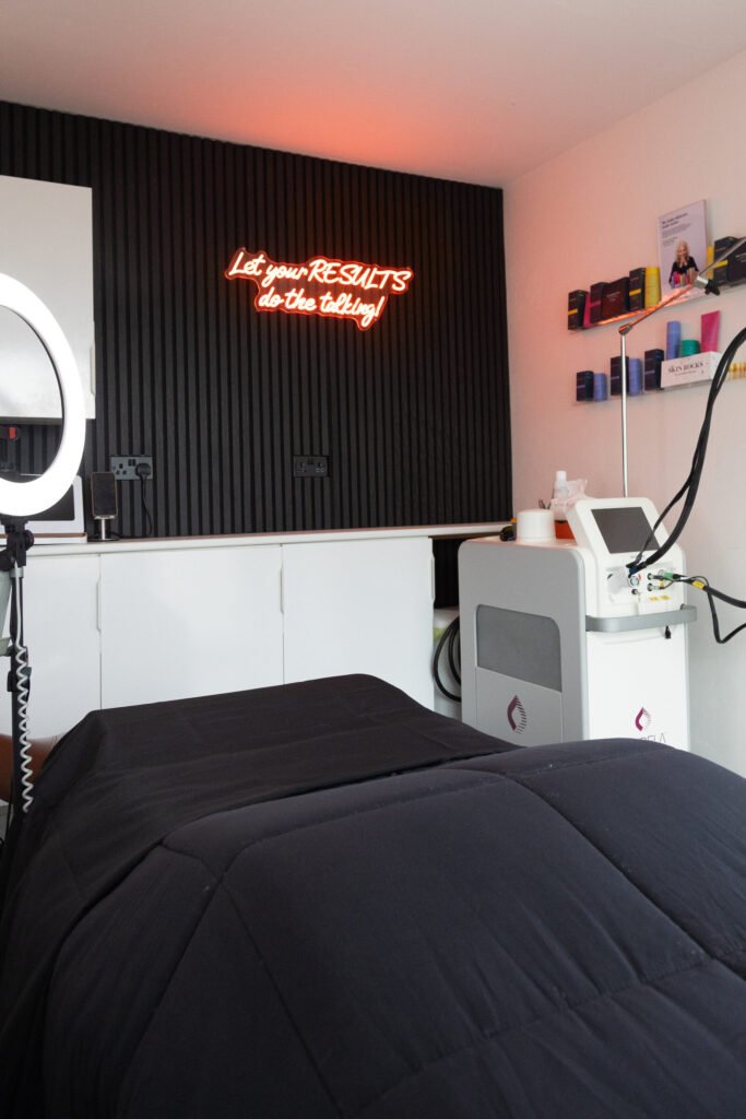 Treatment couch and Candela laser in the private clinic room at WILD Clinic, Worcester