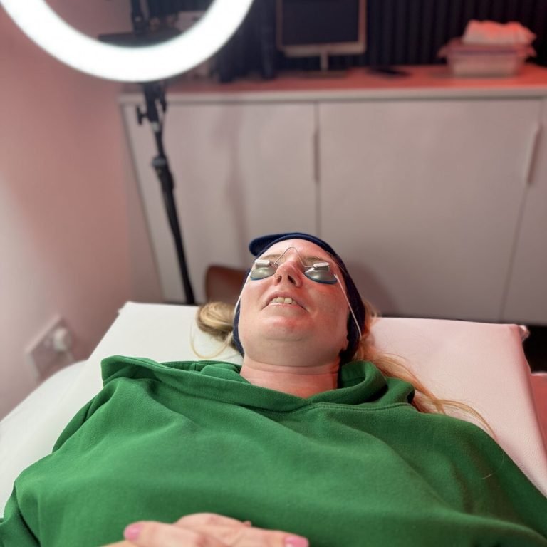 A client resting on the treatment couch during a session